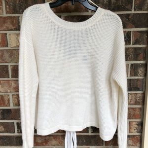 1. State sweater with V back detail